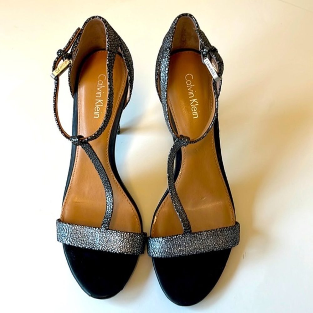 Calvin Klein high heel shoes. Silver in color. 3 1/2 inches high. Size 7‎ 1/2.